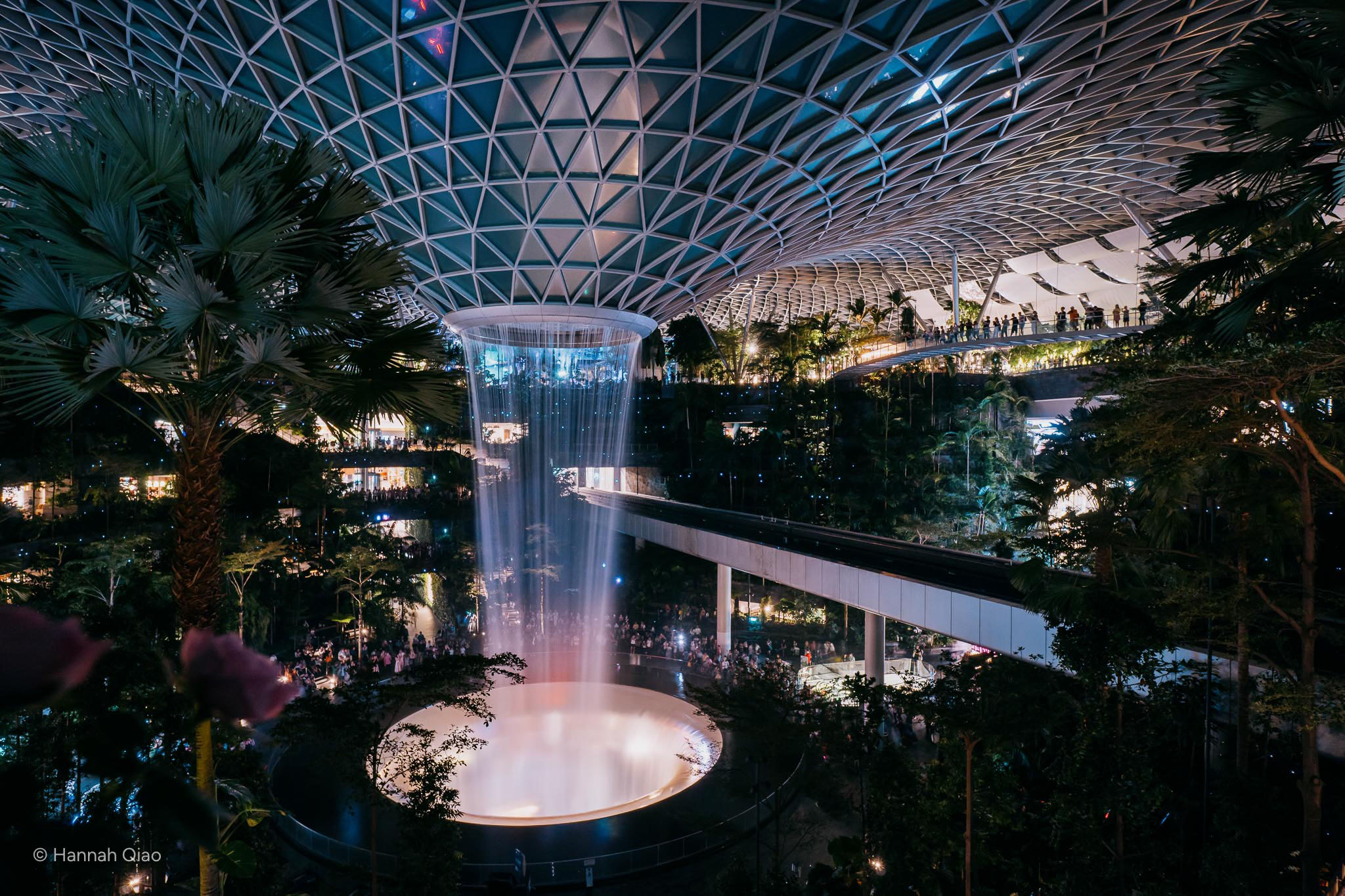 Photo of an indoor waterfall at night, changi airport in singapore